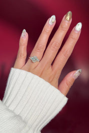 oval lab diamond engagement ring white gold side stones nature inspired cluster style on hand