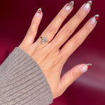 marquise lab diamond yellow gold cathedral setting high polish solitaire engagement ring on hand