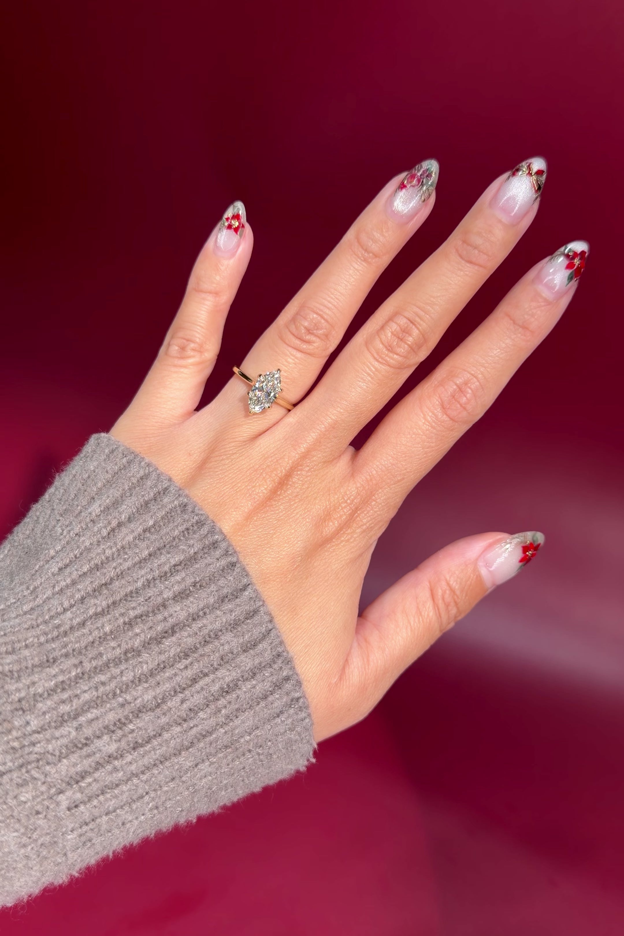 marquise lab diamond yellow gold cathedral setting high polish solitaire engagement ring on hand