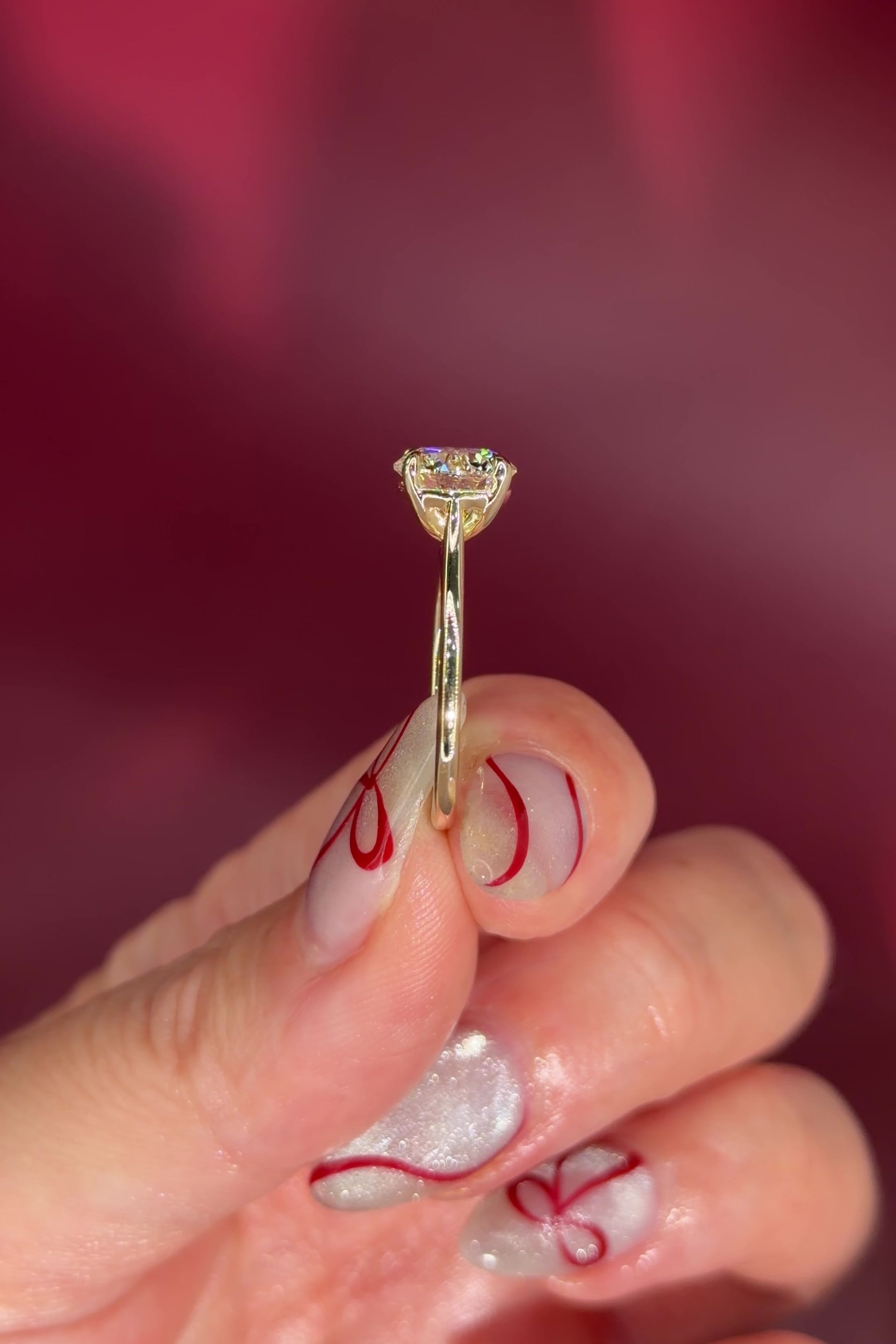 round yellow gold cathedral solitaire 4-prongs yellow gold on hand