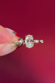 oval floating diamond spaced out band yellow gold engagement ring