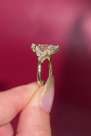 3.01ct F-VVS2 Marquise Lab Diamond Olivia. Three stone style engagement ring featuring two marquise and one round diamond at the bottom of the tro. The marquise act as diamond leaves holding the center stone. From the side profile the Olivia features a diamond bridge and diamond petal prongs.