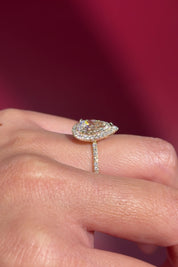 pear lab diamond yellow gold halo engagement ring pave band diamond petal prong basket on hand