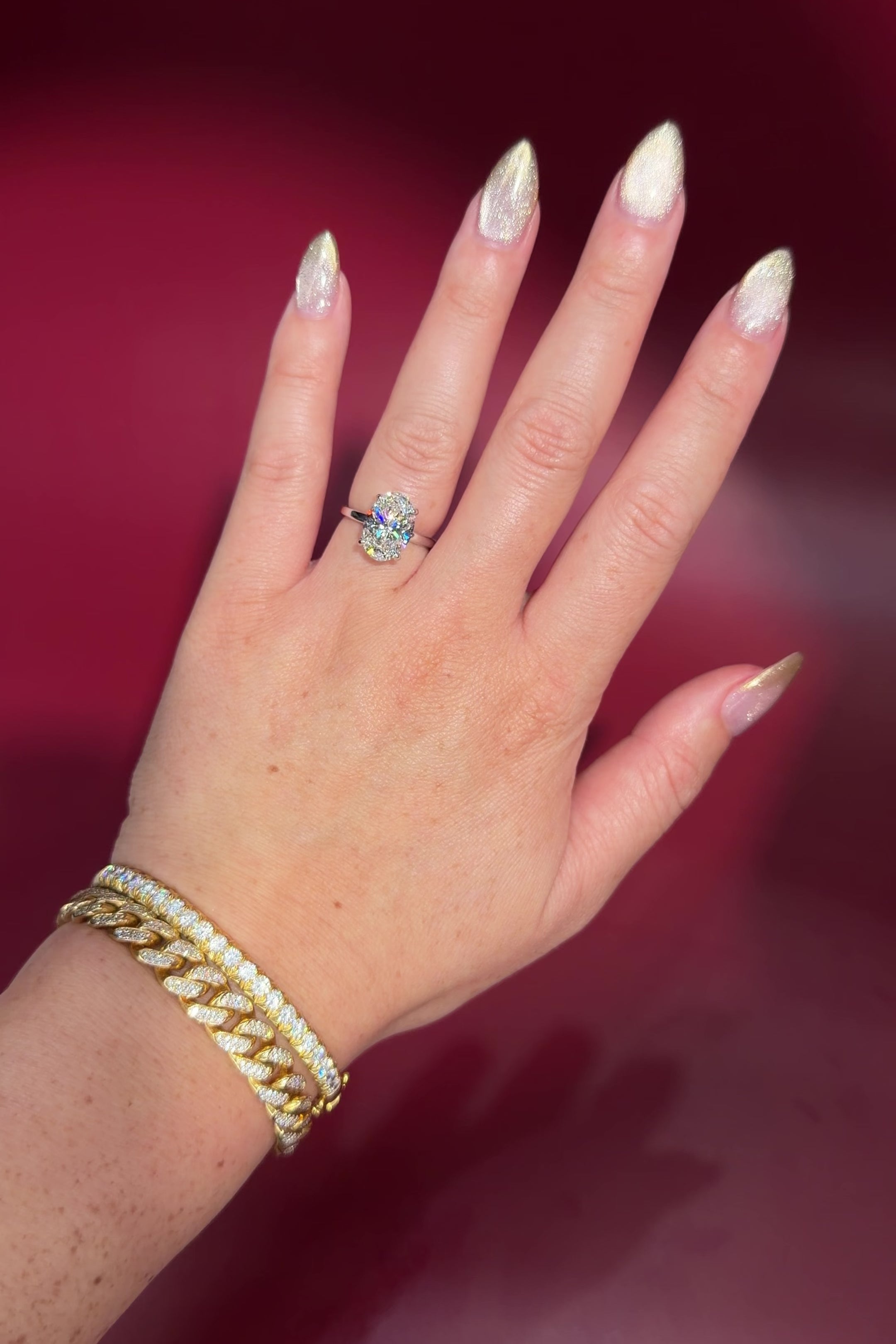 4.07ct D-VS1 Oval Lab Diamond Kayla Oval lab diamond solitaire in white gold with a wrap under halo and high polish plain band.