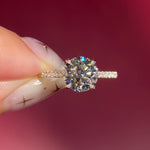 round lab diamond yellow gold engagement ring pavé with cathedral and diamond bridge and diamond prongs