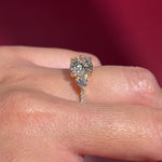 round lab diamond pave yellow gold engagement ring side stones trio on hand