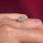 oval lab diamond engagement ring pave band hidden halo yellow gold on hand profile view