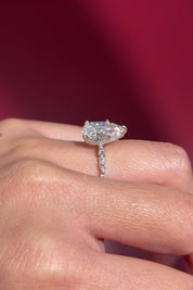 pear lab diamond white gold cathedral engagement ring floating diamond band with hidden halo on hand