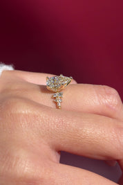 pear lab diamond cluster side stone setting nature inspired engagement ring yellow gold on hand
