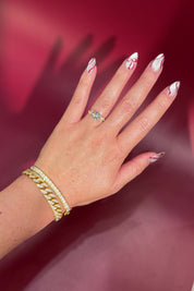 Round Diamond Engagement Ring with Nature Inspired Marquise side diamonds and petal prongs