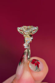 marquise diamond yellow gold engagement ring with alternating side stones