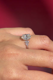 oval lab diamond engagement ring white gold side stones nature inspired cluster style on hand