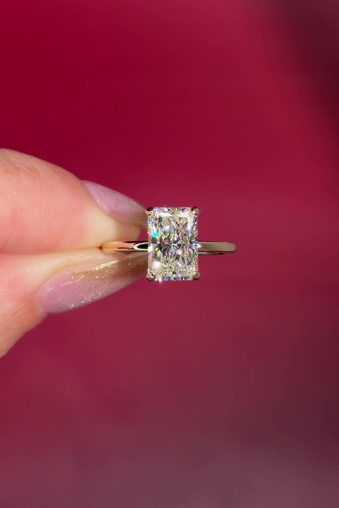 2.54ct F-VS1 Radiant Lab Diamond Leah. Simple and low maintenance, the Leah is a timeless solitaire designed for everyday wear. Crafted in solid 14k yellow gold, this traditional style features our classic belt design four prong head, offering added security while still maintaining one of the lowest maintenance settings we offer ✨