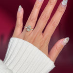 oval lab diamond engagement ring pavé band with diamond prongs and hidden halo on hand