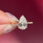 pear lab diamond solitaire engagement ring with cathedral and belt