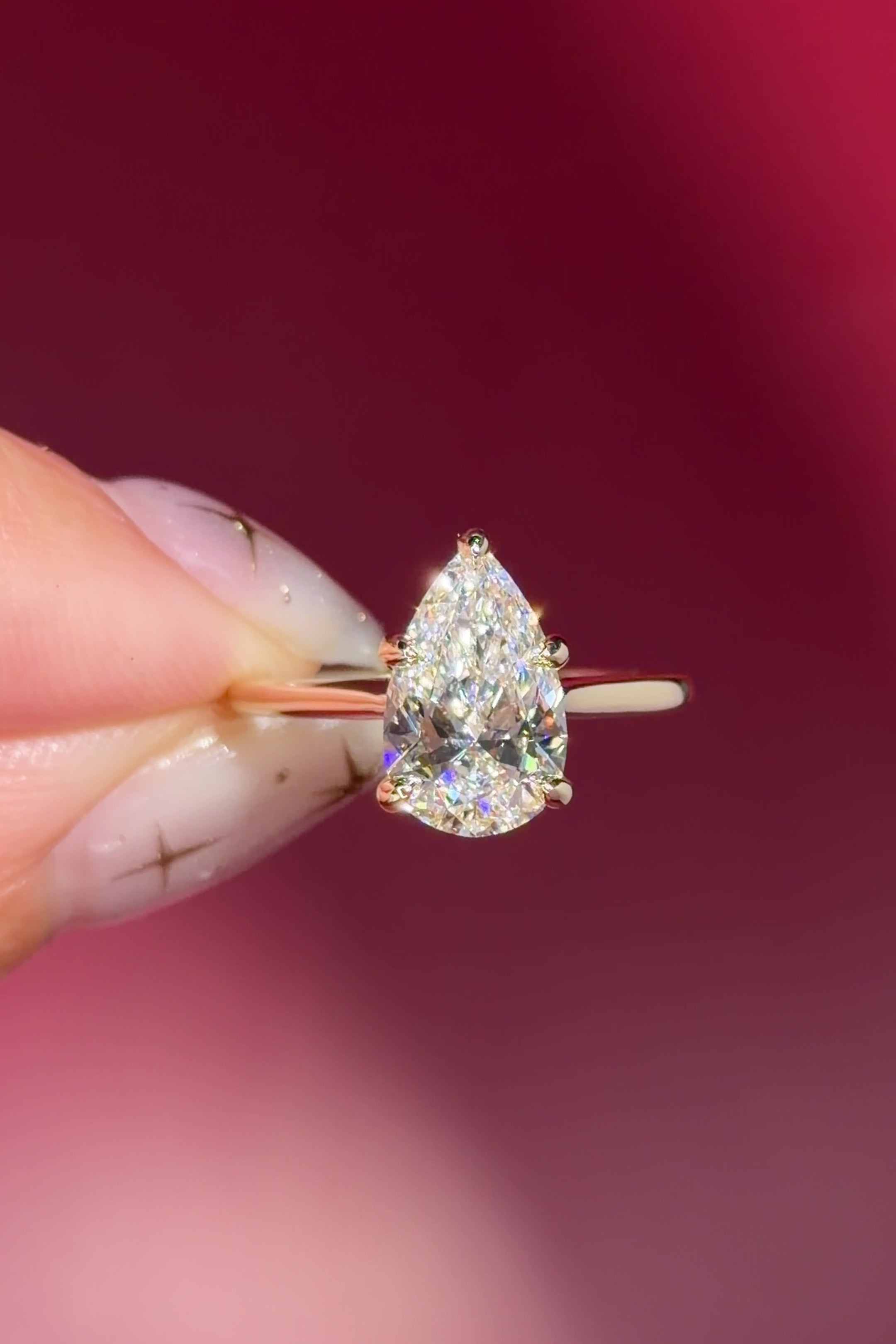 pear lab diamond solitaire engagement ring with cathedral and belt