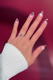 round yellow gold cluster petal prong engagement ring on hand