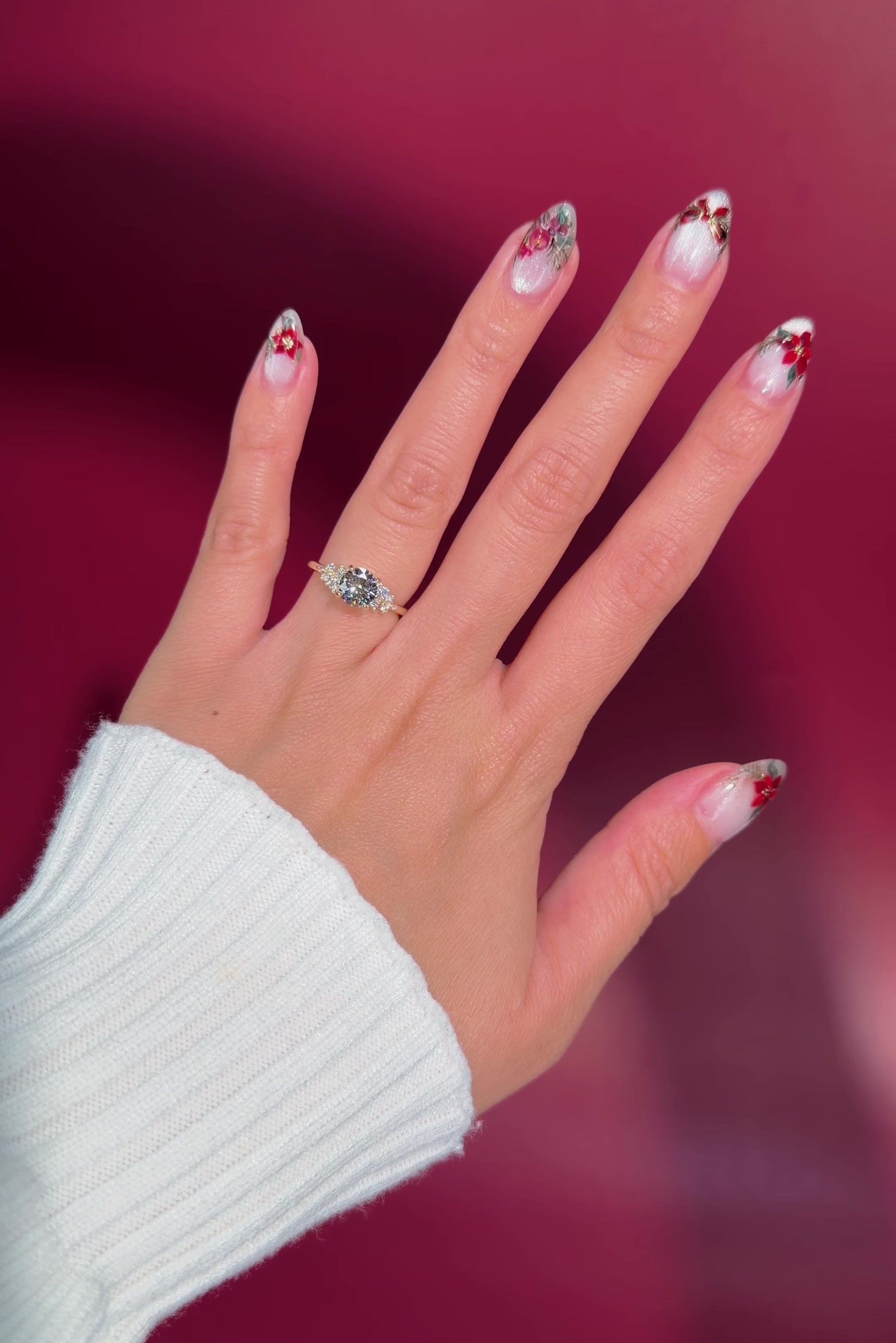 round yellow gold cluster petal prong engagement ring on hand