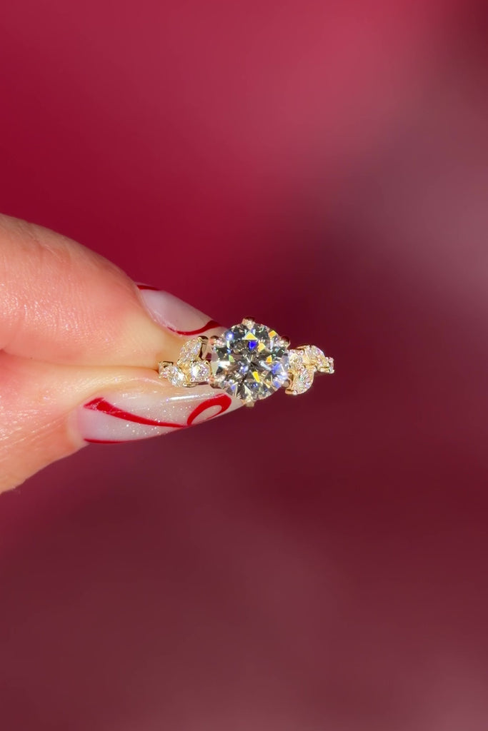 Round Diamond Engagement Ring with Nature Inspired Marquise side diamonds and petal prongs