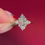 marquise yellow gold engagement ring with pear side stones