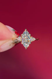 marquise yellow gold engagement ring with pear side stones