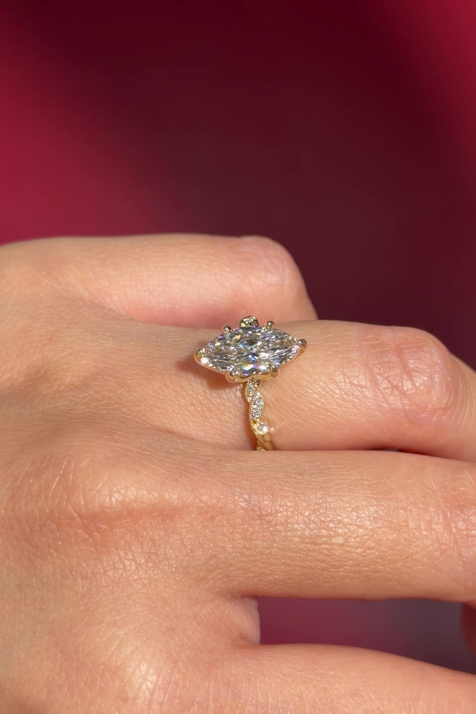 marquise lab diamond vintage style twist band engagement ring yellow gold on hand