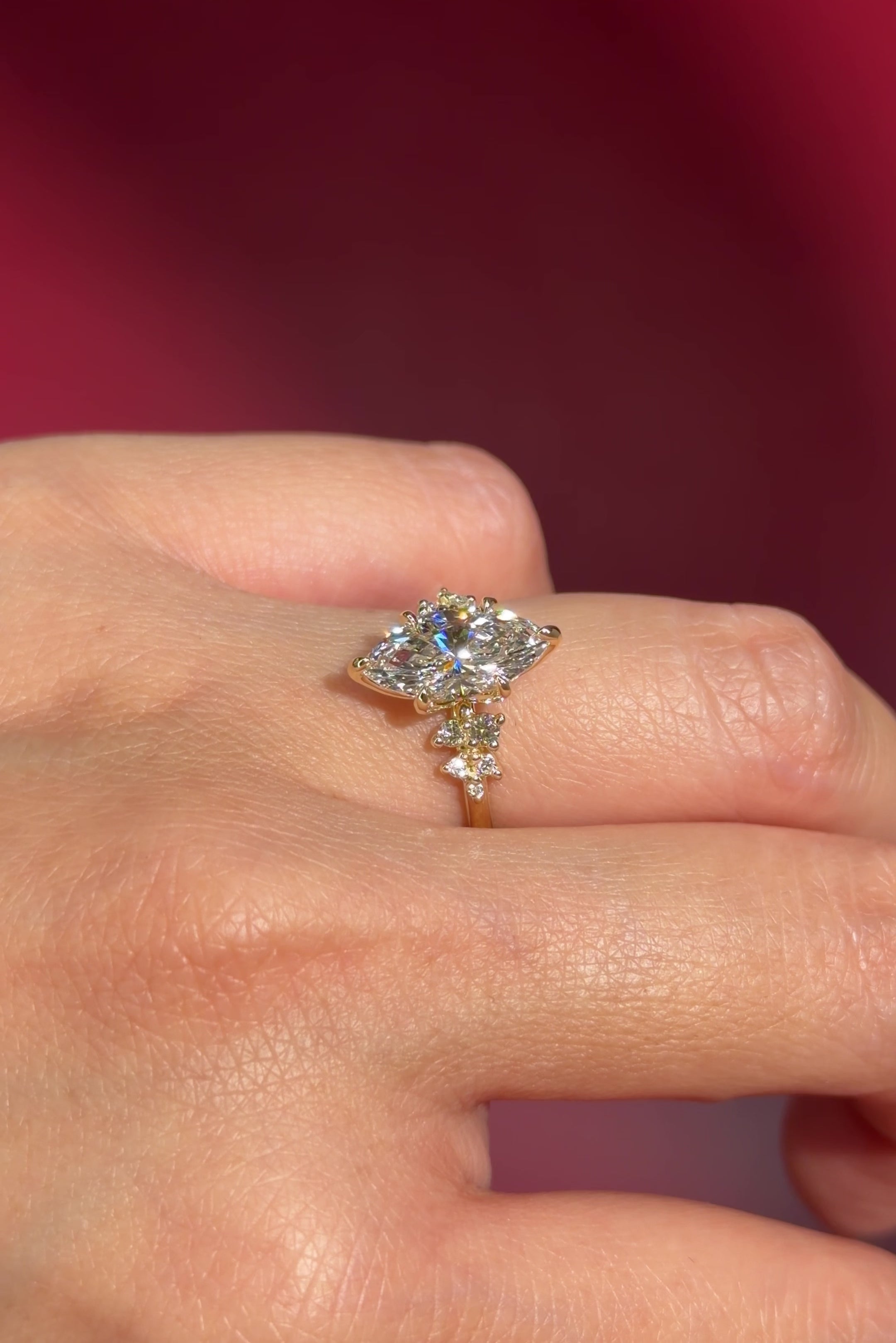 marquise lab diamond yellow gold engagement ring side stone cluster nature inspired on hand