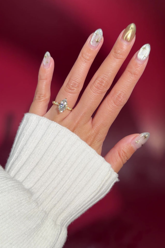 marquise lab diamond vintage style twist band engagement ring yellow gold on hand