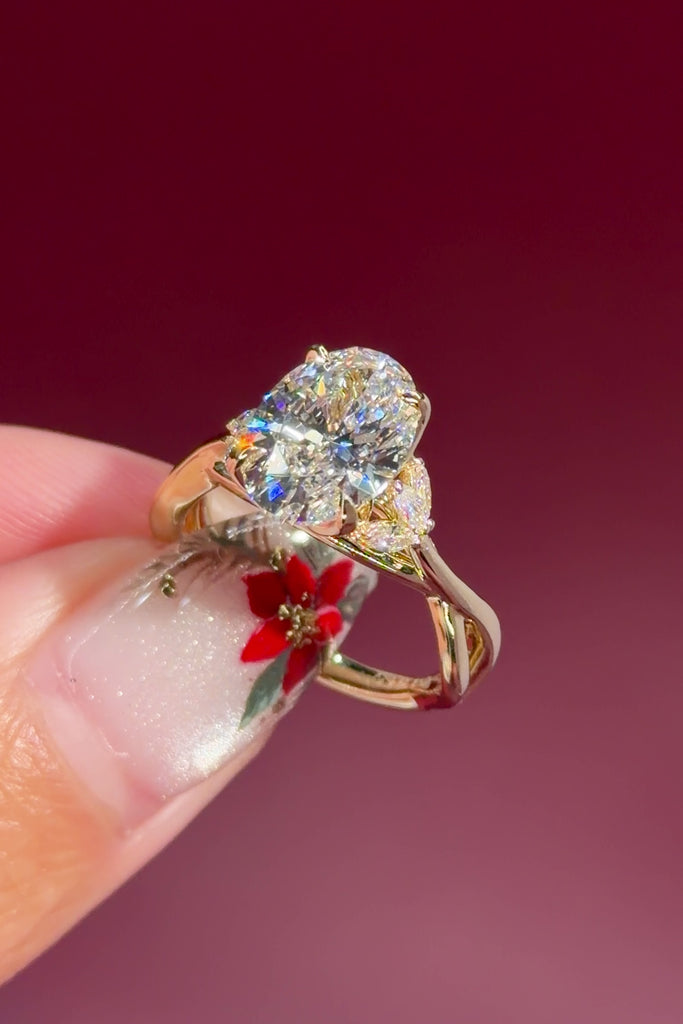 oval lab diamond nature inspired twist band engagement ring yellow gold cluster side stone setting profile