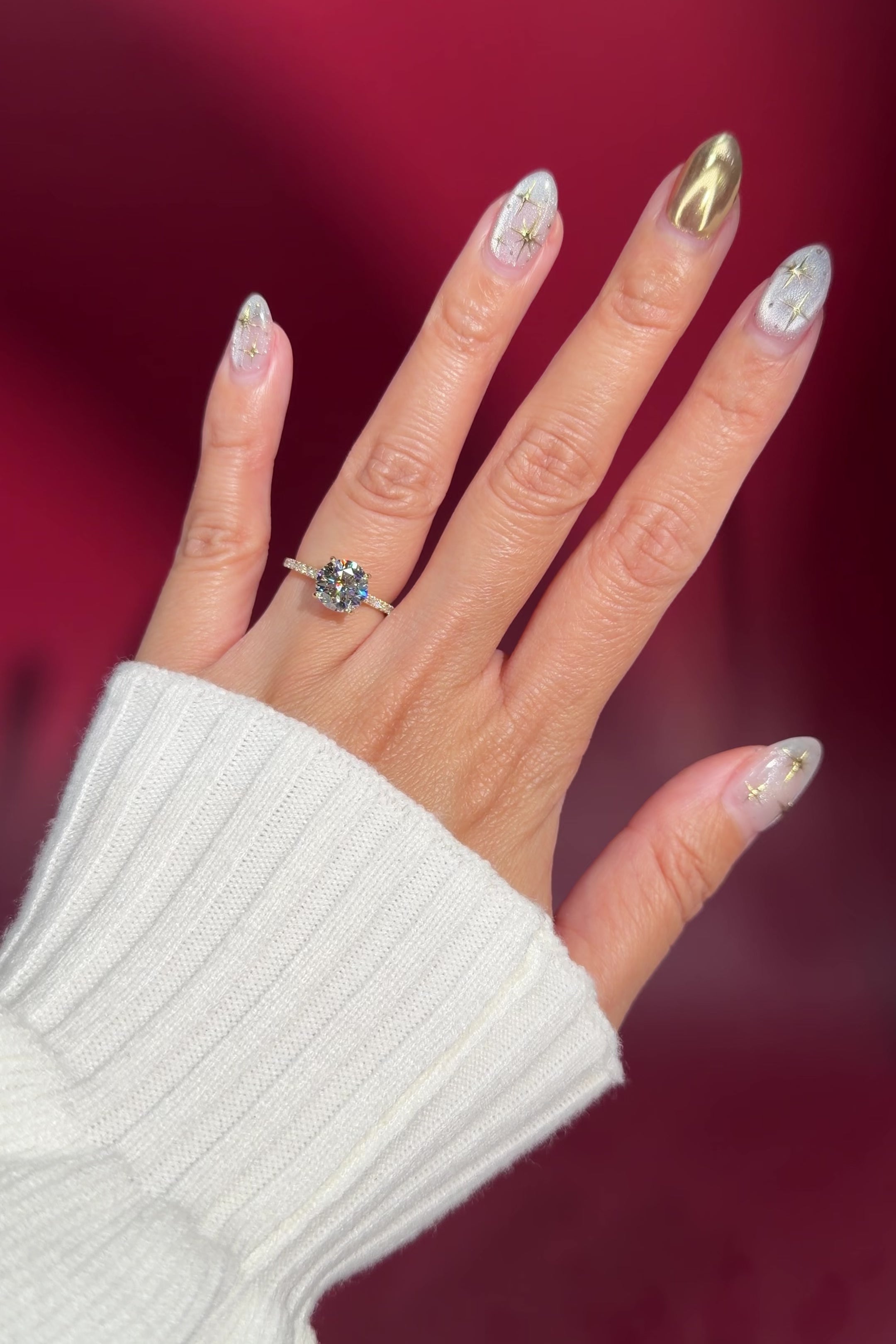 round lab diamond yellow gold engagement ring pavé with cathedral and diamond bridge and diamond prongs on hand