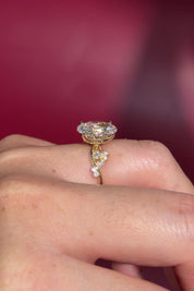 3.04ct E-VVS2 Oval Lab Diamond Ariel. The Ariel engagement ring is inspired by the sea. A unique twist on the classic Nova design, Ariel features a captivating center stone enveloped by wave-like contours. Delicate diamond bubble side stones, reminiscent of ocean bubbles, add a whimsical touch. Crafted precisely, this ring seamlessly blends timeless elegance with an underwater allure.