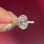 oval lab diamond engagement ring pavé band with diamond prongs and hidden halo