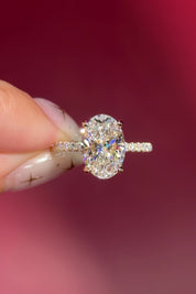 oval lab diamond engagement ring pavé band with diamond prongs and hidden halo