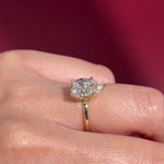 pear lab diamond solitaire engagement ring with flower petal prong basket yellow gold on hand