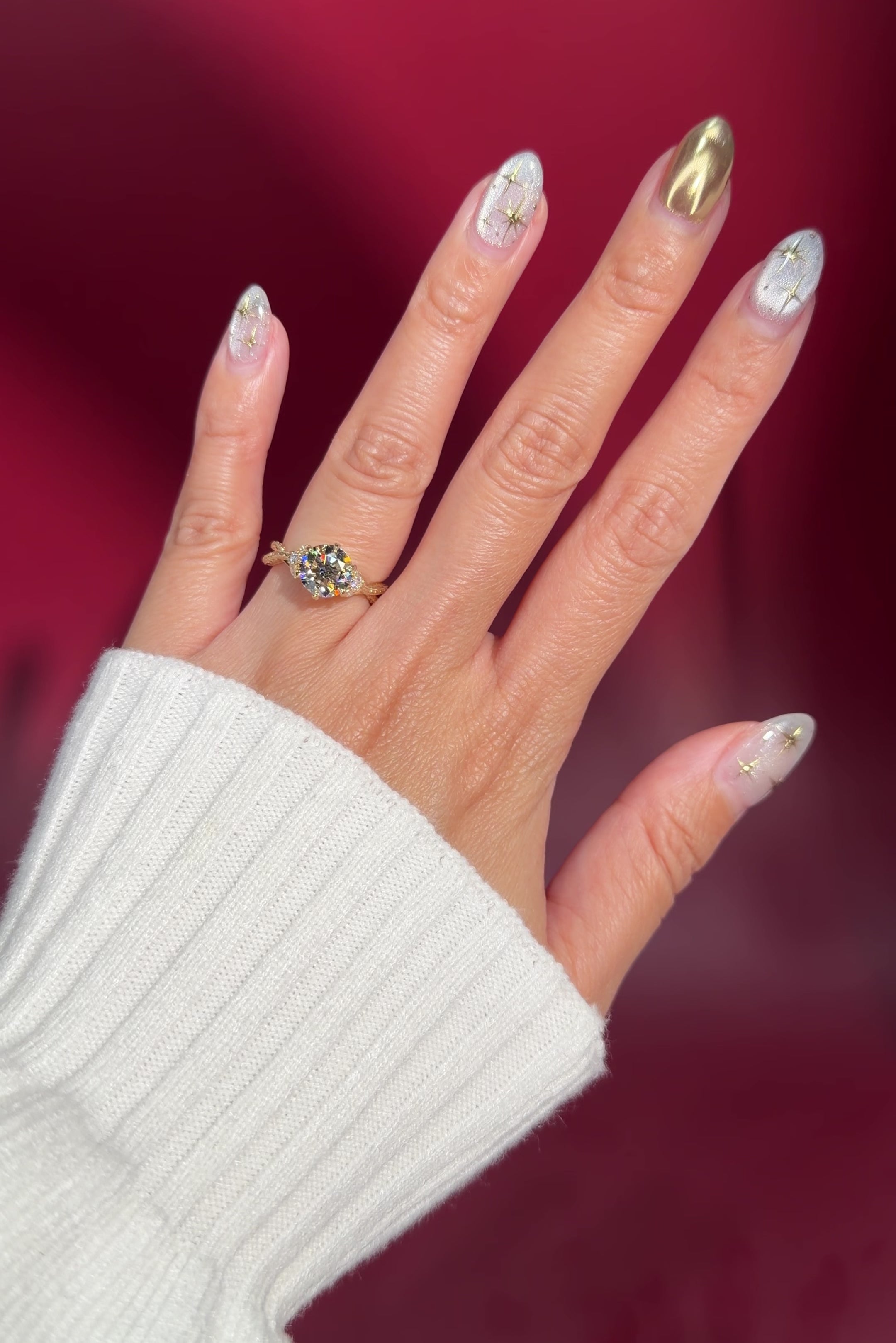 round lab diamond engagement ring leafy side marquise diamonds twist band engraved yellow gold on hand