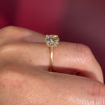 round yellow gold cathedral solitaire 4-prongs yellow gold on hand