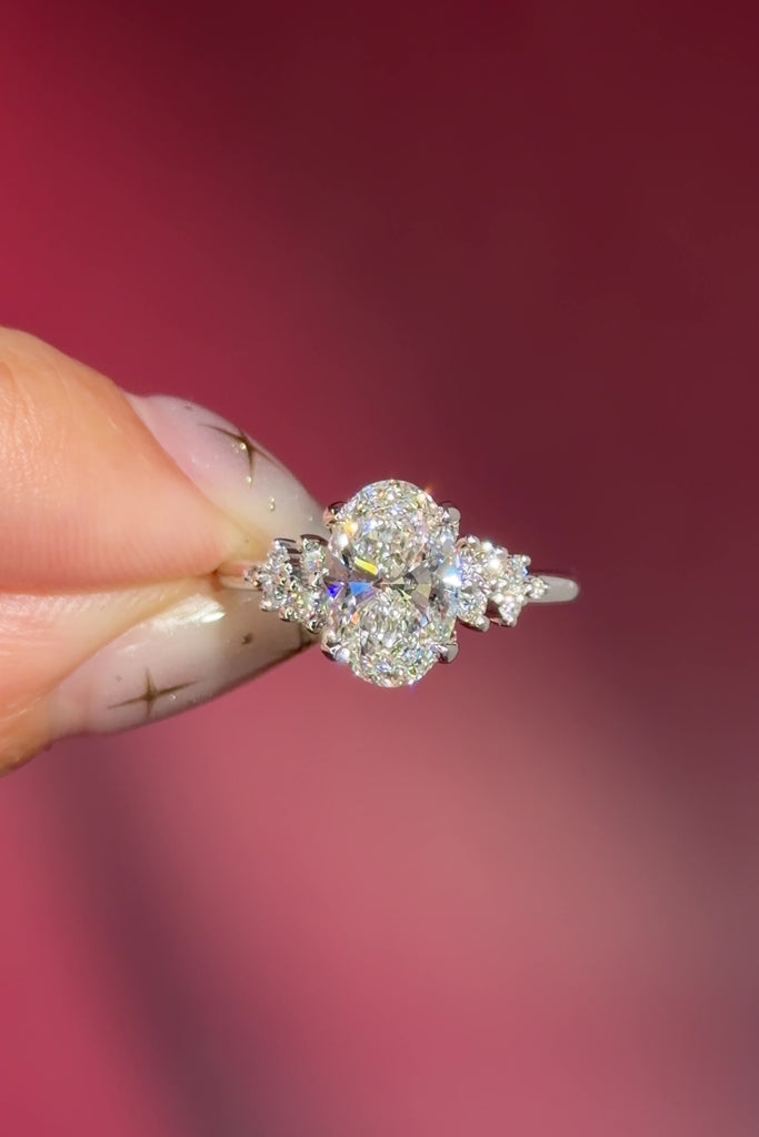 oval lab diamond engagement ring white gold side stones nature inspired cluster style