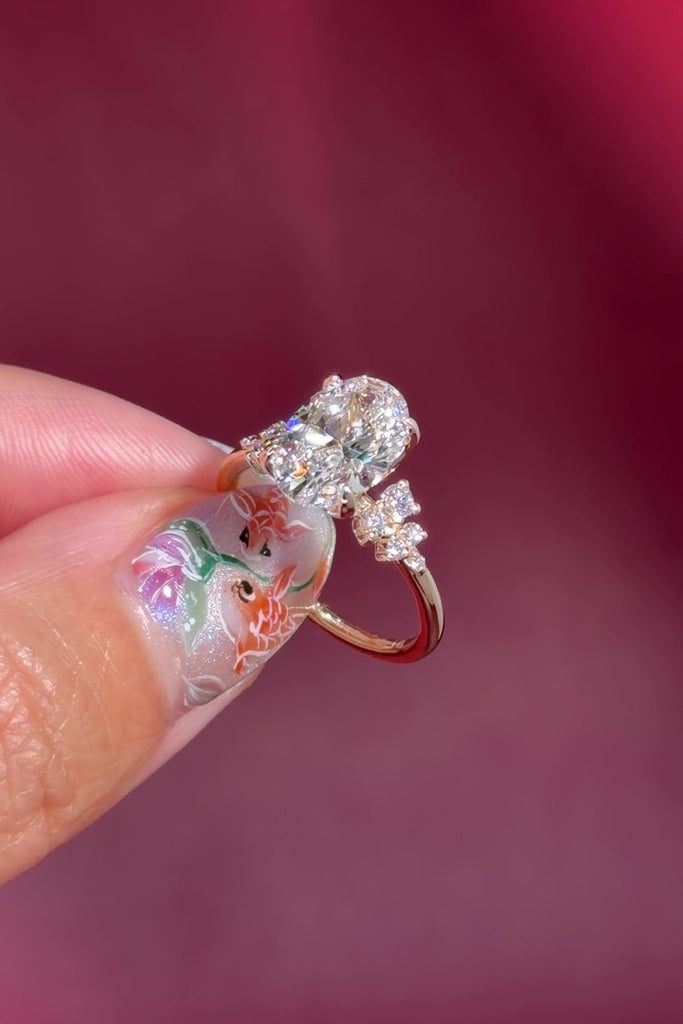 oval lab diamond cluster side stone nature inspired yellow gold engagement ring setting with petal prong basket