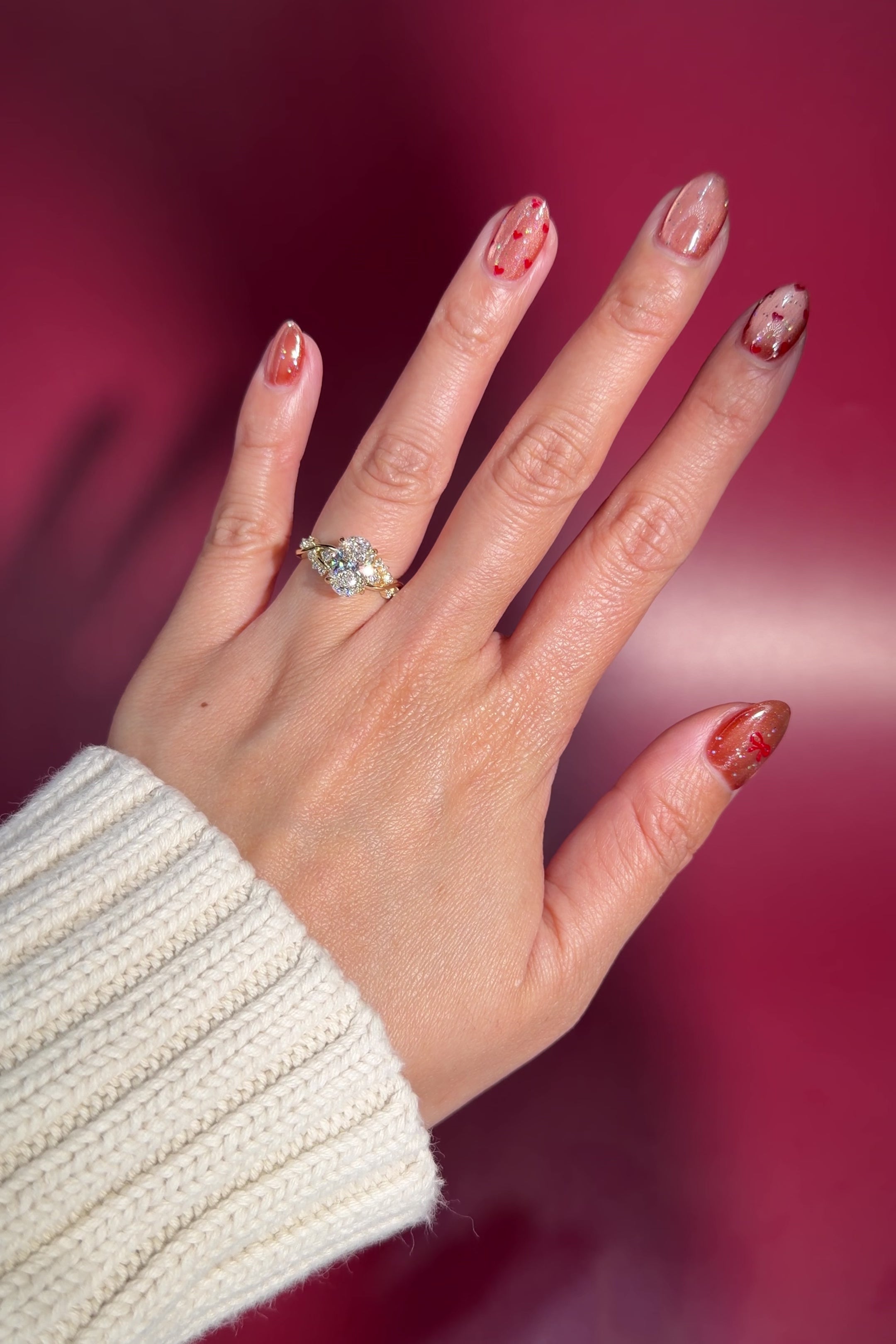 2.03ct oval lab diamond engagement ring whimsical nature inspired curved band with side stones and petal prong basket yellow gold on hand