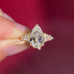 3.03ct D-VVS2 Pear Lab Diamond Brandi.

The Brandi is an inline style engagement ring featuring a symmetrical cluster of side diamonds that create a bold, sculptural look ✨

Because of its inline design, straight wedding bands will not stack flush. This style pairs best with a curved or custom wedding band, or it can be worn beautifully on its own without a wedding band at all 💛

A striking choice for those who love a statement engagement ring with intentional design details 💍