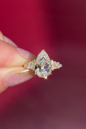 3.03ct D-VVS2 Pear Lab Diamond Brandi.

The Brandi is an inline style engagement ring featuring a symmetrical cluster of side diamonds that create a bold, sculptural look ✨

Because of its inline design, straight wedding bands will not stack flush. This style pairs best with a curved or custom wedding band, or it can be worn beautifully on its own without a wedding band at all 💛

A striking choice for those who love a statement engagement ring with intentional design details 💍