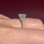 1.01ct D-VS1 Oval Lab Diamond Lindsey. The Lindsey features a classic high polish band with a trio of diamond side stones to perfectly accent your selected center stone.