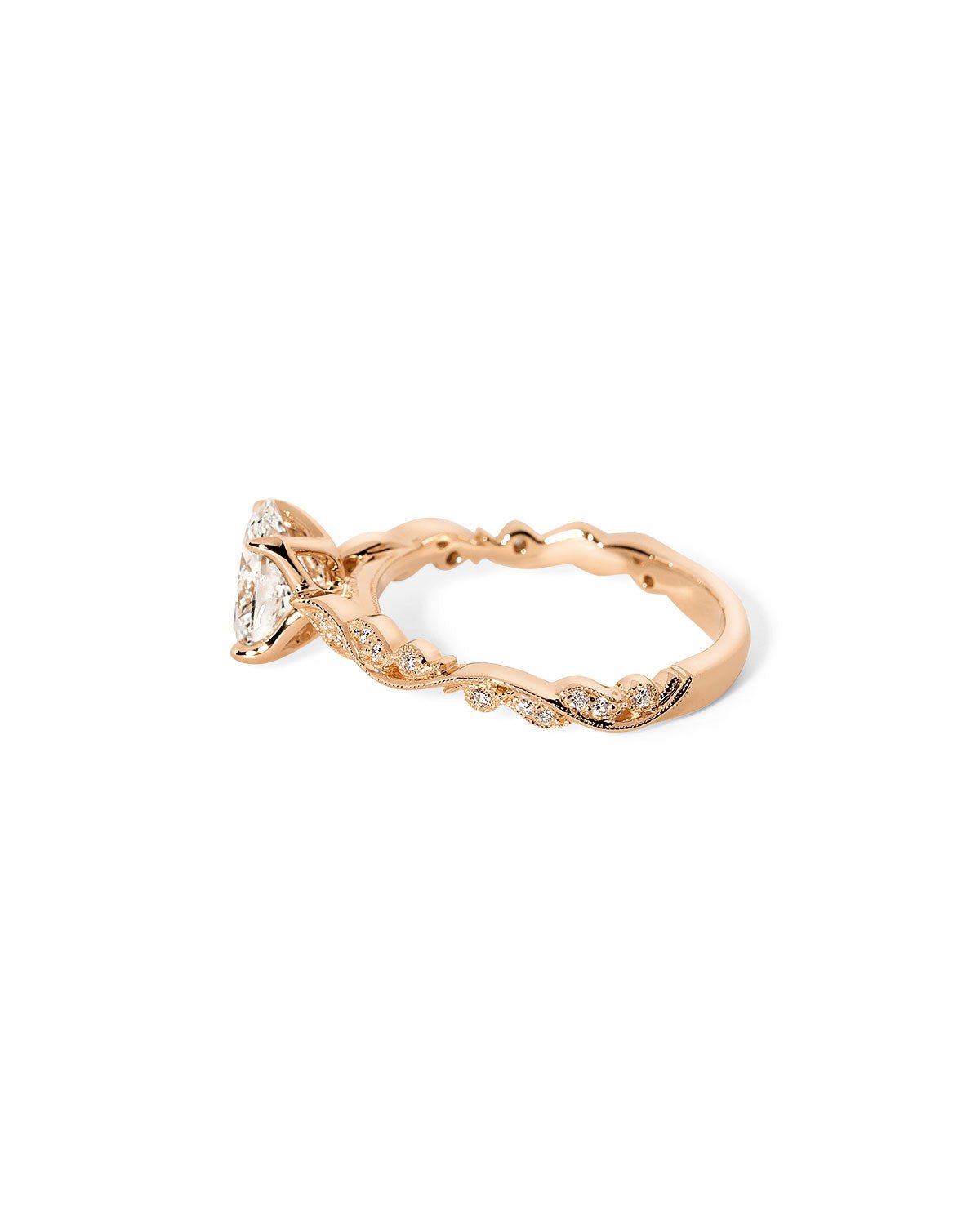 Angled view of the Rosette Oval Cathedral rose gold engagement ring with 75% eternity diamond band and romantic vintage-inspired design at Princess Bride Diamonds jewelry store in Orange County