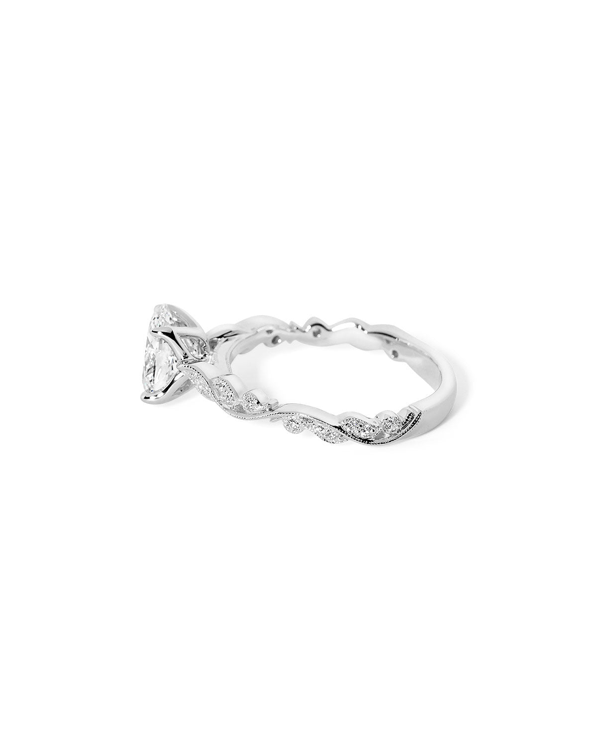 Angled view of the Rosette Oval Cathedral white gold engagement ring with 75% eternity diamond band and refined vintage detail at Princess Bride Diamonds jewelry store in Orange County
