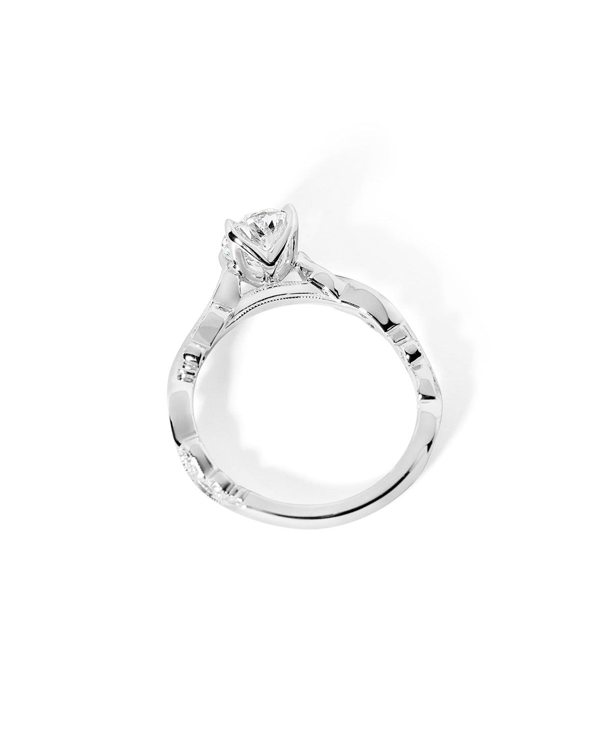 Side profile of the Rosette Oval Cathedral white gold engagement ring featuring a milgrain-detailed bridge and cathedral setting at Princess Bride Diamonds jewelry store in Orange County

