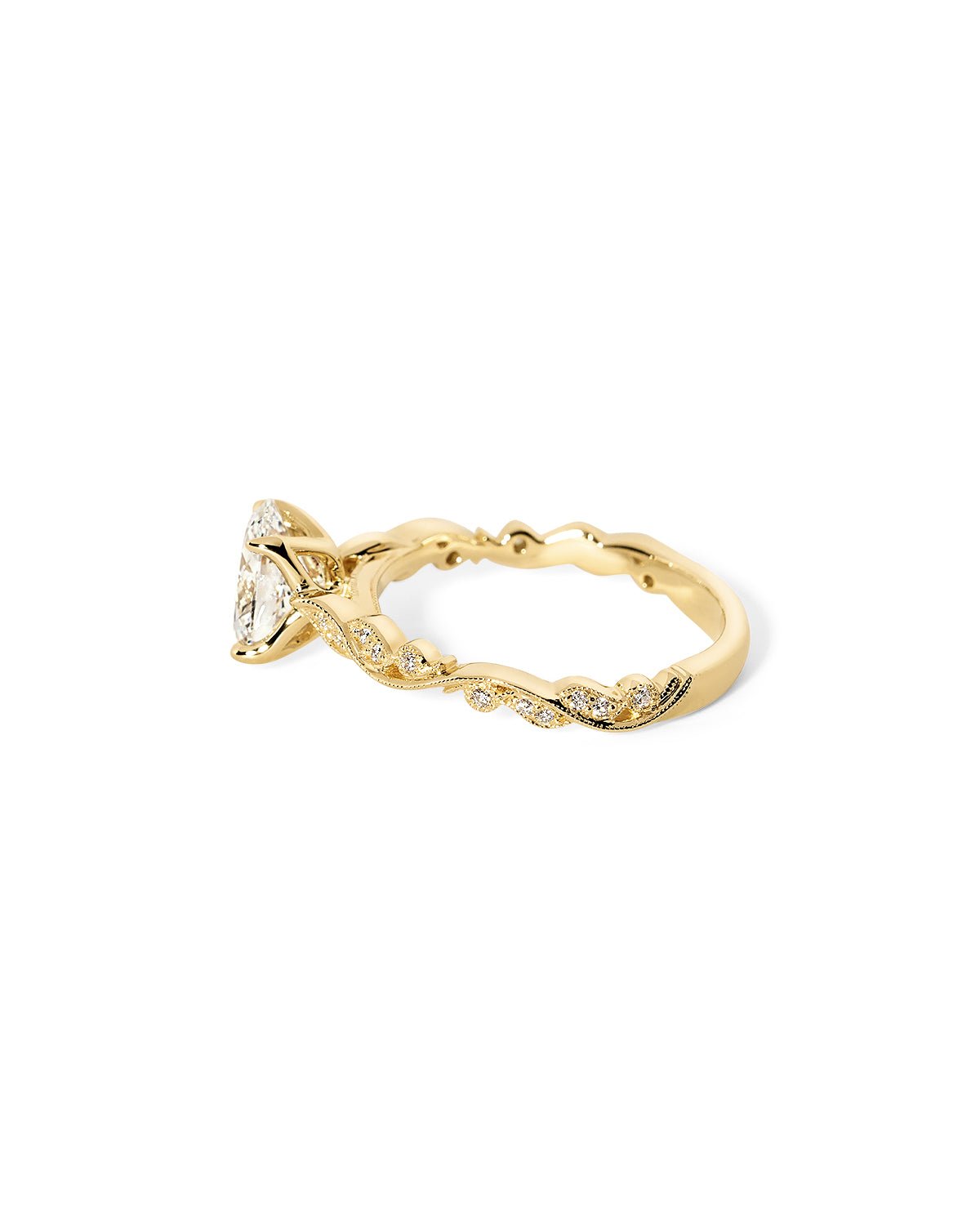 Angled view of the Rosette Oval Cathedral yellow gold engagement ring with 75% eternity diamond band and vintage-inspired details at Princess Bride Diamonds jewelry store in Orange County