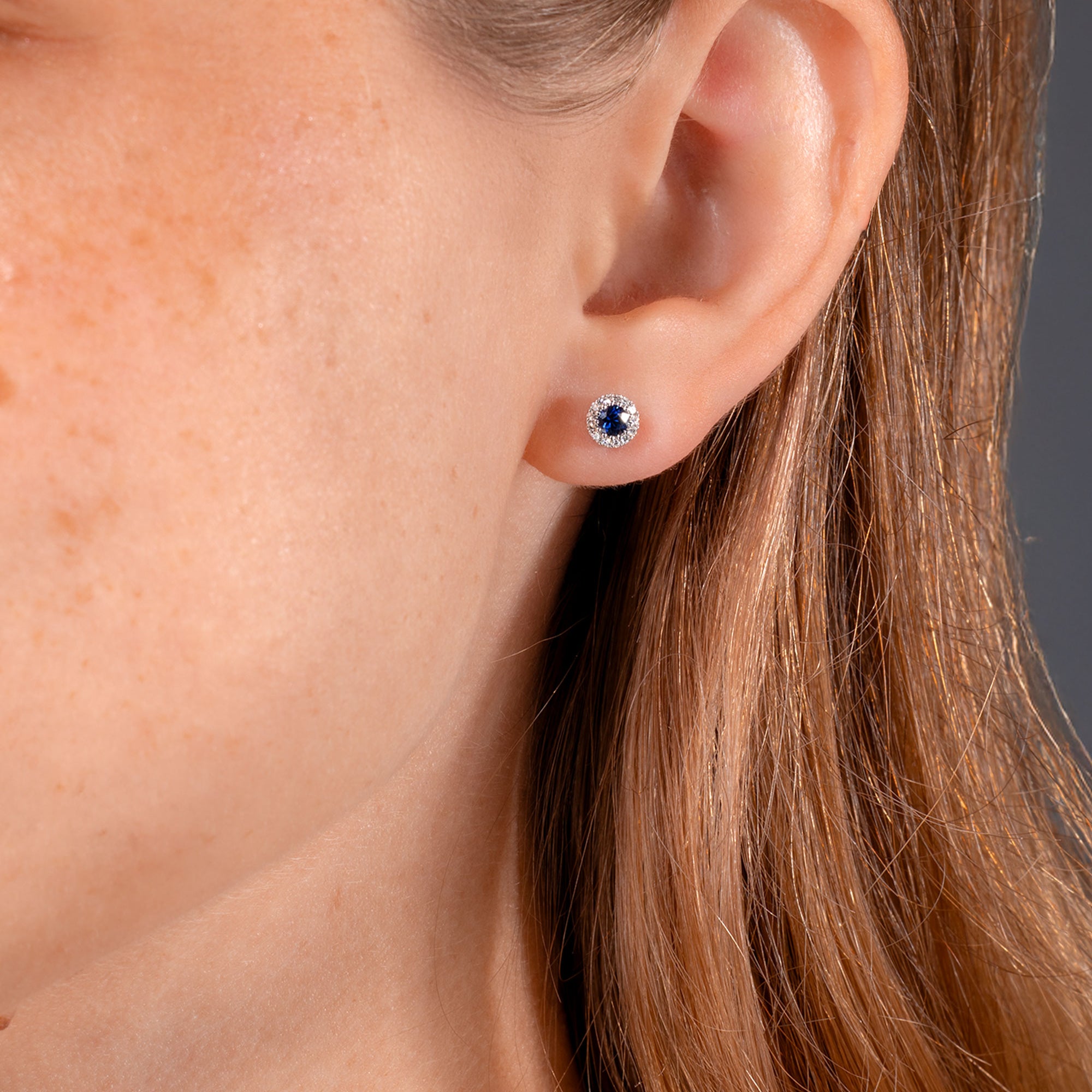 sapphire-halo-studs-round-close.jpg
