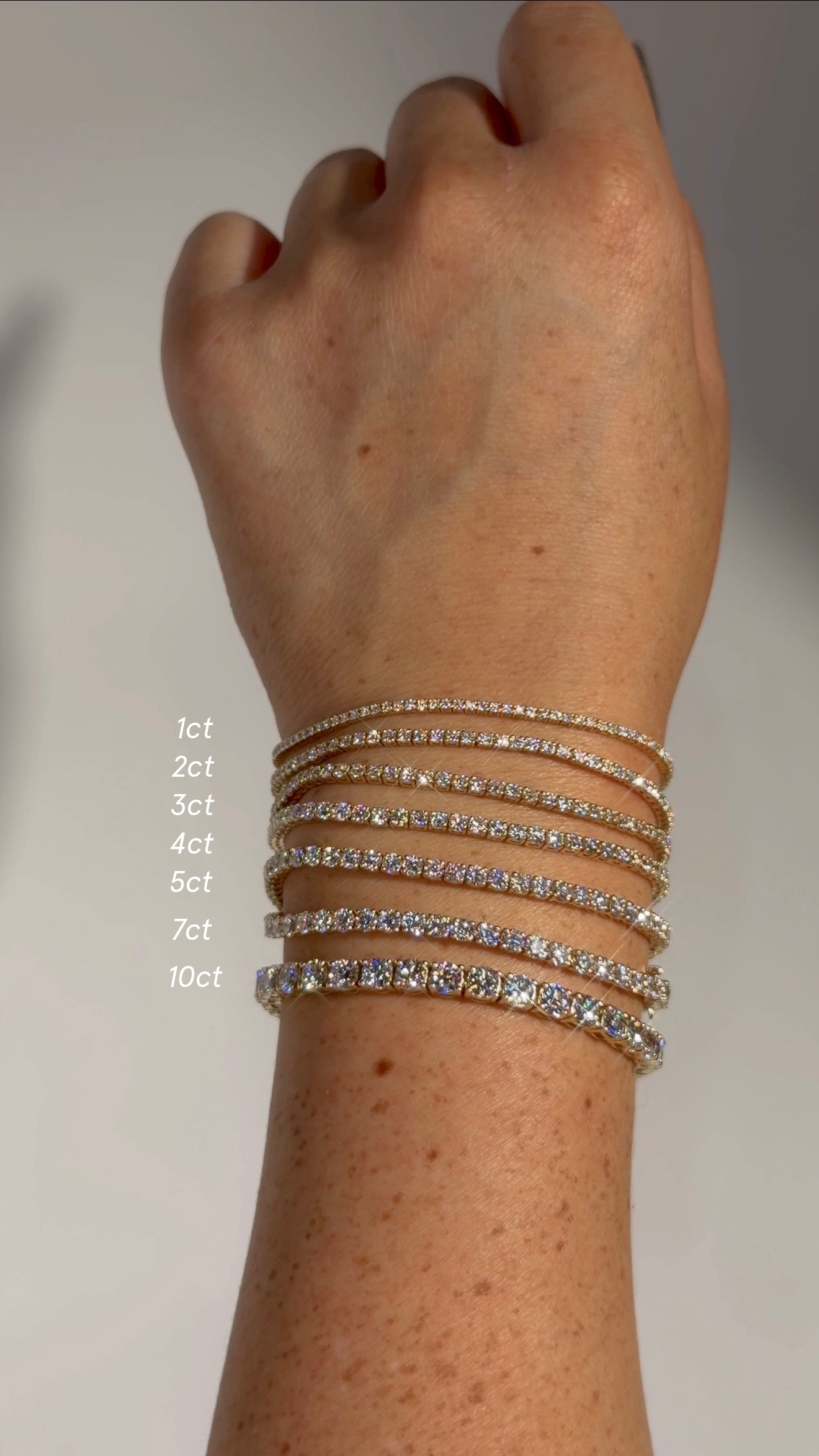 Diamond tennis bracelet carat size comparison from 1ct to 10ct in 14k yellow gold – lab-grown diamond bracelets shown side by side for visual scale and sparkle difference.