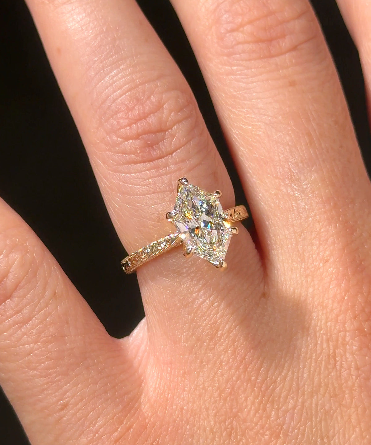 Victoria Dutch Marquise Hand Engraved engagement ring, worn on the hand in 14K yellow gold