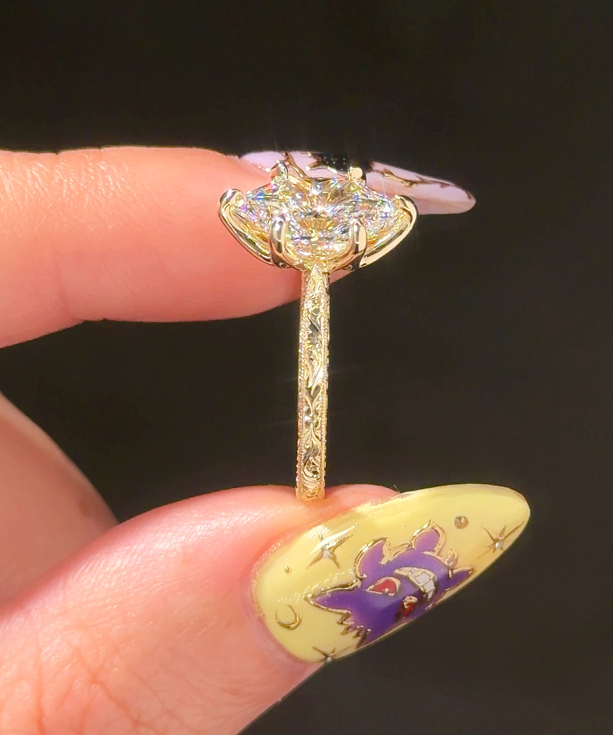 Victoria Dutch Marquise Hand Engraved engagement ring, end view showing the engraved band in 14K yellow gold